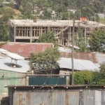 building being built & wood scaffolding