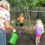 watering the beans they just planted